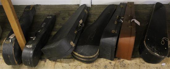 7 cased violins and 5 other uncased incomplete violins
